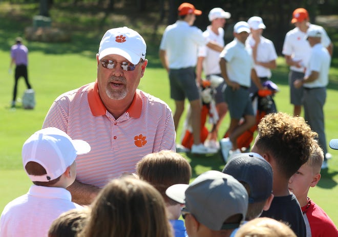 Clemson golf coach Larry Penley talks with a group of kids during the annual Sticks for Kids event held Tuesday afternoon, April 16, 2019, at the Cramer Mountain Club in Cramerton. [Mike Hensdill/The Gaston Gazette]