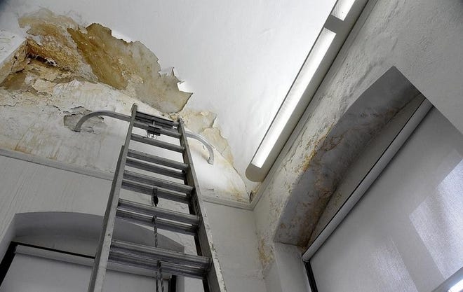 Water damage is visible through the ceiling of the southwest side of Fall River Public Library in January. [Herald News File Photo / Dave Souza]