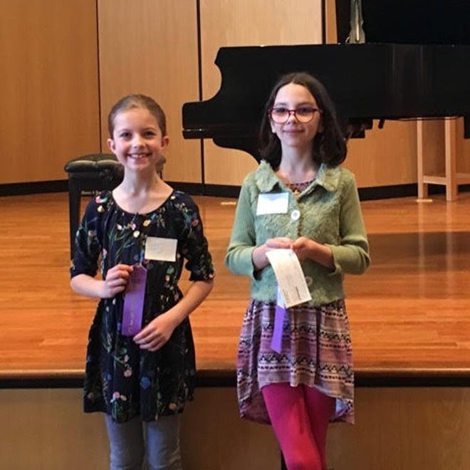 Winners in the Elementary Division of the Holland Piano Teachers' Forum competition were Charlotte Burch, first, and Lucy Carpenter, second. [CONTRIBUTED]