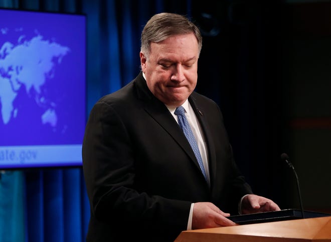 Secretary of State Mike Pompeo turns from the podium after speaking at a news conference at the State Department in Washington, Wednesday, April 17, 2019. The Trump administration announced that it's allowing lawsuits against foreign companies operating in properties seized from Americans in Cuba, a major policy shift that has angered European and other allies.(AP Photo/Pablo Martinez Monsivais)