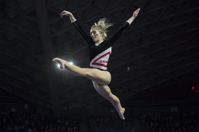 Sydney Snead competes on the beam at a meet in Stegeman Coliseum earlier this season. [Photo/ Jenn Finch, Athens Banner-Herald]