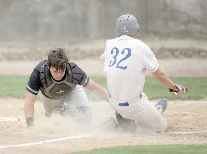 Boonville sophomore Lane West slides safely into home plate during the third inning of a win over Centralia on Wednesday in the opening round of the annual Boonville Wood Bat Tournament. [Chris Bowie/Boonville Daily News]