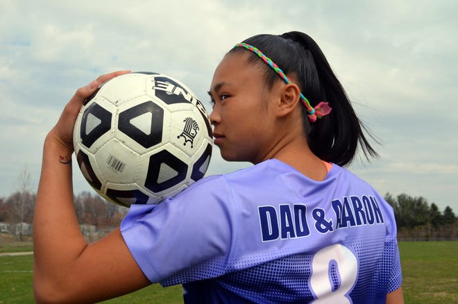West Ottawa's Britney Inthavong has helped organize the Purple Power game for cancer research in memor of her father. [Dan D'Addona/Sentinel staff]