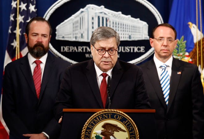 Attorney General William Barr speaks alongside Deputy Attorney General Rod Rosenstein, right, and acting Principal Associate Deputy Attorney General Edward O'Callaghan, left, about the release of a redacted version of special counsel Robert Mueller's report during a news conference Thursday at the Department of Justice in Washington. [Patrick Semansky/The Associated Press]