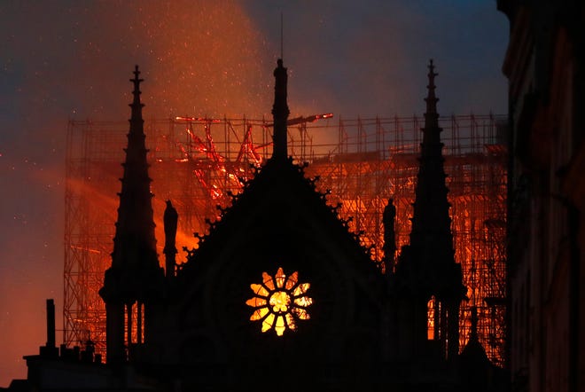 Flames and smoke rise from Notre Dame cathedral as it burns in Paris, Monday, April 15, 2019. (AP Photo/Thibault Camus)