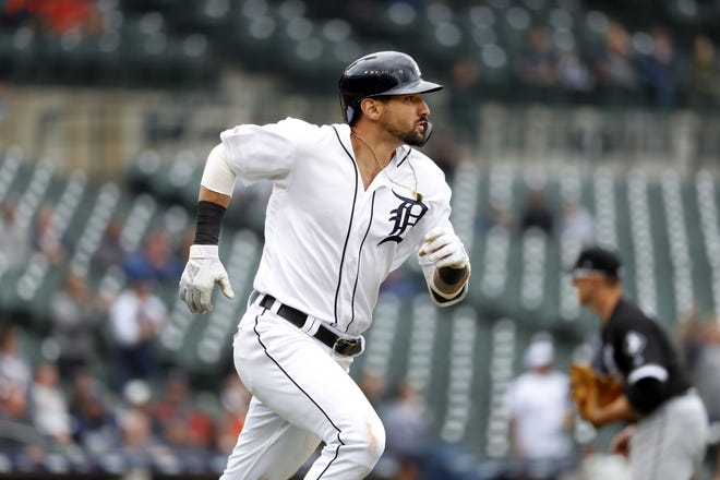 Detroit Tigers' Nicholas Castellanos watches his double as he rounds first base in the eighth inning of a baseball game in Detroit, Thursday, April 18, 2019. JaCoby Jones scored on the play. (AP Photo/Paul Sancya)