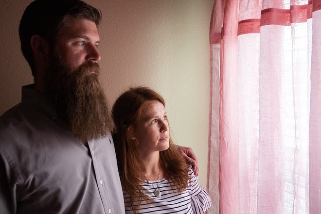 Thomas and Ami Davis of Frisco look out the window of their daughter Ellie's bedroom. Ellie was 3 months old when she died last April while in the care of a licensed in-home facility. [Jeffrey McWhorter/for Statesman]