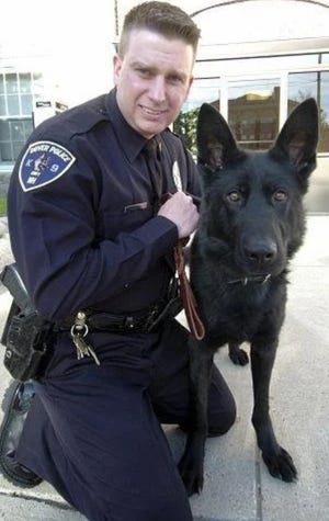 Dover police Detective Timothy Keefe with Grinko. [John Huff/Fosters.com, file]