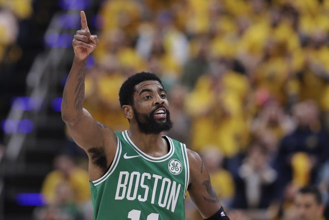 Boston Celtics guard Kyrie Irving gestures during the first half of Game 3 of the team's first-round playoff series against the Indiana Pacers Friday night in Indianapolis. (AP Photo/Darron Cummings)
