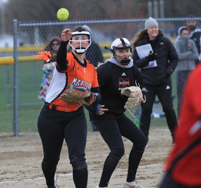 Marcellus pitcher McKenna Rogers fires over to first base to record an out on Friday.