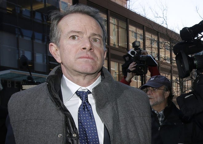 Gordon Ernst arrives at federal court in Boston for his March 25 arraignment in the college-bribery case. He is accused of accepting $2.7 million in bribes to help children of the rich and famous gain entrance to Georgetown, where he formerly coached tennis. [AP. file / Steven Senne]