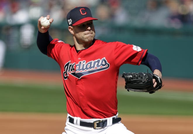 Indians starting pitcher Corey Kluber delivers to the Atlanta Braves in the first inning during the first game of a doubleheader Saturday in Cleveland. The second game was not over at press time. [TONY DEJAK/THE ASSOCIATED PRESS]