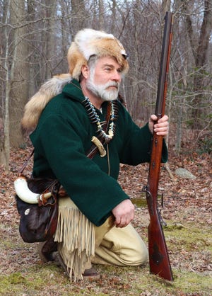 An avid shooting sports competitor, Folco is shown with his .54 caliber muzzleloader he used to win several State and New England championship titles. Accoutrements he made by hand, from animals he has hunted, include a bear claw necklace, a coyote fur hat, and a possibles bag (from deer and moose). [PHOTOS PROVIDED BY MARC FOLCO]