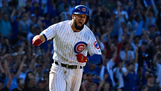 Chicago Cubs' David Bote (13) reacts after hitting a walk off single during the ninth inning of a baseball game against the Arizona Diamondbacks Sunday, April 21, 2019, in Chicago. (AP Photo/Matt Marton)