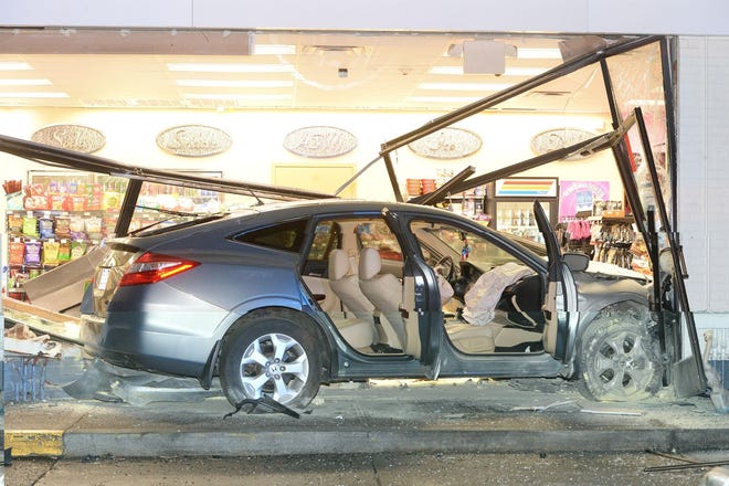 A car drove into the Westside Shell, 945 Belmont Street in Brockton, on Thursday, April 18, 2019. The driver of the vehicle was transported to the hospital. (Marc Vasconcellos/The Enterprise)