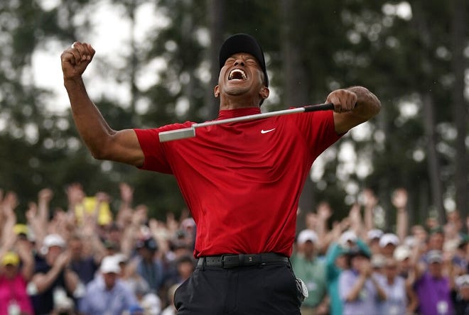 Tiger Woods reacts as he wins the Masters golf tournament Sunday, April 14, 2019, in Augusta, Ga. [ DAVID J. PHILLIP ]