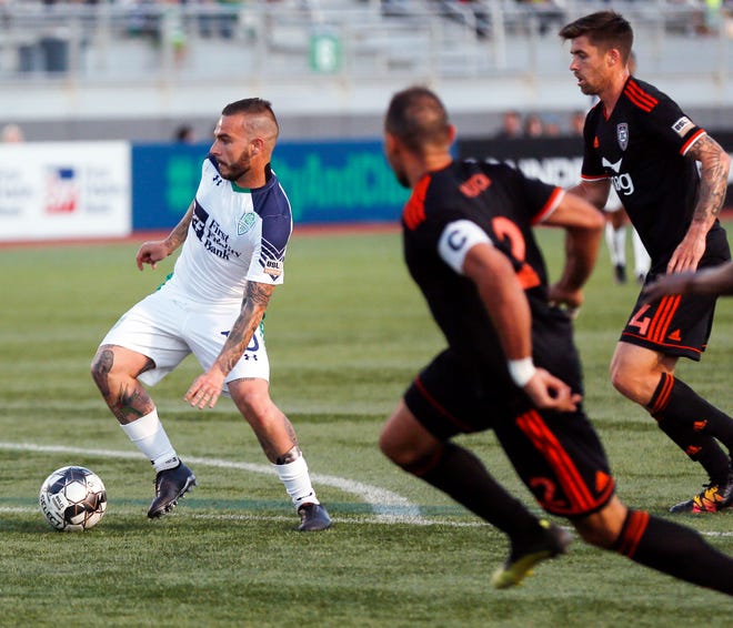 Oklahoma City's Alexy Bosetti (10), left, dribbles away from Orange County players during a USL soccer game between the OKC Energy FC and Orange County SC at Taft Stadium in Oklahoma City, Saturday, April 20, 2019. Photo by Nate Billings, The Oklahoman
