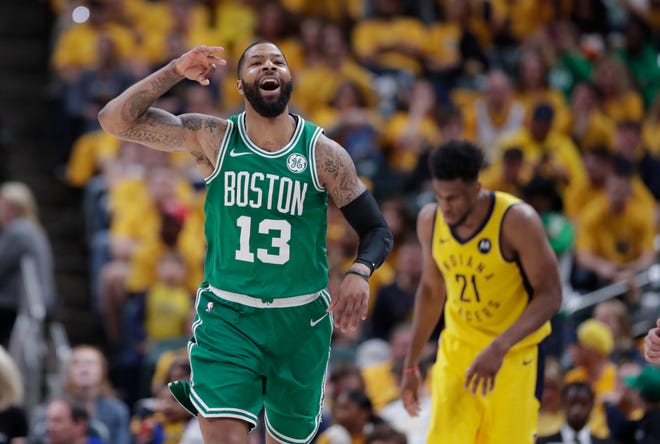 Celtics forward Marcus Morris celebrates Boston's Game 4 victory and series sweep of the Indiana Pacers on Sunday in Indianapolis. [The Associated Press]