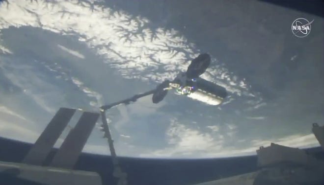 This photo provided by NASA shows a cargo ship arriving at the International Space Station, Friday, April 19, 2019. (NASA via AP)