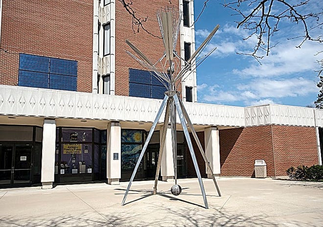 Thanks to a grant from the federal Institute of Museum and Library Services (IMLS) awarded by the State Library of Ohio, the Ashland University Library has scheduled the restoration and rededication of the most recognizable artwork on the Ashland University main campus: John Clague’s auriculum. This large and distinctive stainless steel and lead sculpture was assembled on campus in 1973 with support from a federal grant. Clague (1928–2004) intended for Auriculum to complement the new library’s Brutalist architectural style, and to bring “interactive joy” to the AU community by combining visual, auditory and tactile elements in the work. Jim Gwinner of the McKay Lodge Art Conservation Laboratory will complete a restorative treatment to the sculpture in late April. An open house with light refreshments to celebrate the restoration will be held on Thursday, May 2, from noon to 2 p.m., with a brief rededication ceremony taking place at 1 p.m. The festivities are free and open to the public.