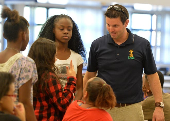 Eustis Heights Elementary Principal Chad Frazier speaks to sixth-grade students at Eustis Middle School. “Few understand the needs of our nation’s schools better than the educators that work in them every day,” Frazier said in a press release. [Whitney Lehnecker / Daily Commercial]