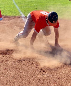 Meadowbrook High's Garrett Clendenning scrambles across home plate during first-ining action of Monda's OVAC Class 4A semifinal game against St. Clairsville. The Colts won, 7-1, to advance to Friday's championship game against defending champion Edison.
