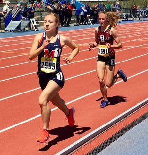 Manhattan senior Clara Mayfield, left, leads the state in the girls 1,600 and 3,200 meters after last weekend's Kansas Relays. [Rick Peterson/The Capital-Journal]