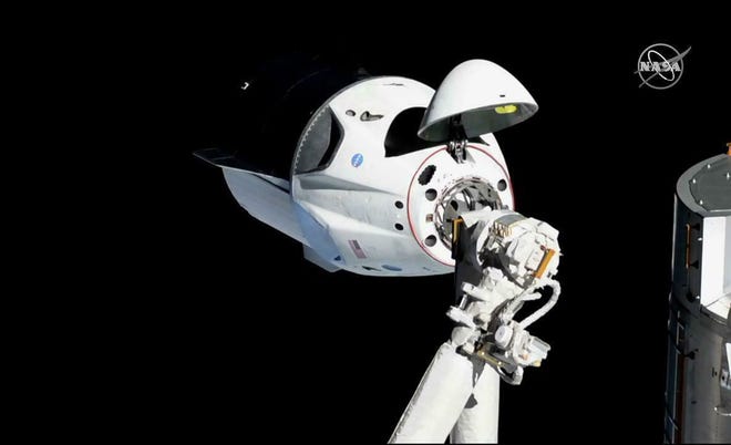 In this March 3 photo provided by NASA, the SpaceX Crew Dragon is pictured about 20 meters away from the International Space Station's Harmony module. Officials say SpaceX's new capsule for astronauts suffered an "anomaly" during a routine engine test firing in Florida, causing smoke to be seen for miles. Forty-fifth Space Wing spokesman Jim Williams tells Florida Today that the anomaly happened Saturday at Cape Canaveral Air Force Station while the SpaceX Crew Dragon capsule was undergoing a "static test fire." [NASA via AP, File]