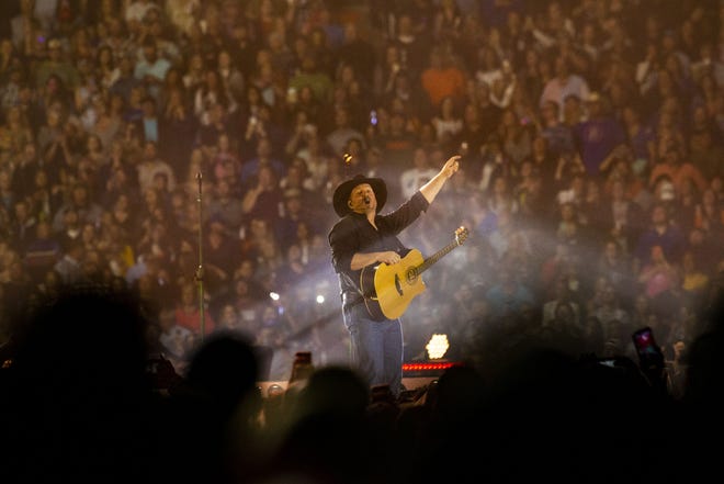 Garth Brooks performs for a sold out crowd at Ben Hill Griffin Stadium on April 20, 2019. A late arriving crowd, many of them unfamiliar with Ben Hill Griffin Stadium and the University of Florida campus, made for a bumpy start to the first concert in the stadium in 25 years. 



[Lauren Bacho/Gainesville Sun]