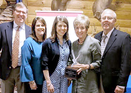 Colleen Oess, second from right, recipient of the 2019 Distinguished Citizen from the Muskingum Valley Council of the Boy Scouts of America, poses with her family, left to right, Eric and Barb Oess, Louise Jones and Bob Oess.