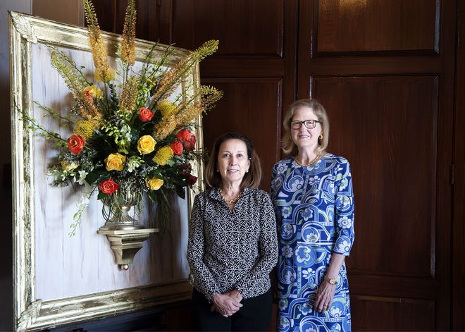 Mary Pressly and Elizabeth "Sugar" Thebaut, president of the Garden Club of Palm Beach, stand beside the arrangement Pressly created for the entrance to the club's flower show. This year's theme is Gold Leaf. The show will be held Wednesday and Thursday at The Society of the Four Arts' Esther B. O'Keeffe Gallery Building. [Meghan McCarthy/palmbeachdailynews.com]