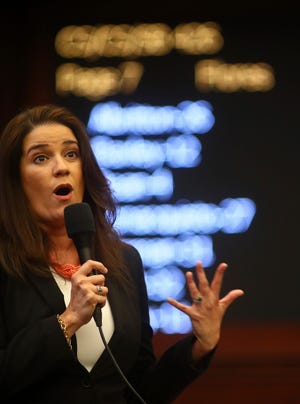 Sen. Anitere Flores, R-Miami, closes on her Senate Bill 426: Firefighters, which expands health benefits to include some cancer coverage, Tuesday in the Florida Senate in Tallahassee. [Phil Sears/The Associated Press]