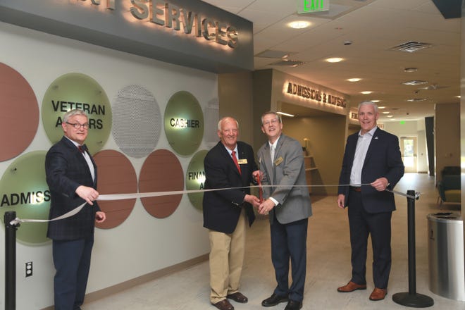 Craven CC held a ribbon cutting for its renovated First Stop department on April 16. The modernized space consolidates all services into one central location to better assist students and streamline the registration and financial aid processes. Pictured left to right are John Farkas of JKF Architecture, Craven CC Trustee Chair Bill Taylor, Craven CC President Dr. Ray Staats and Craven CC Trustee Kevin Roberts. (Photo by Meredith Laskovics)