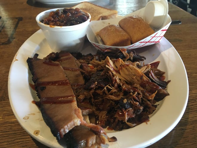 A two-meat dinner of brisket and pork with sides of jalapeno cornbread and the "best beans on the planet." [Austin Fuller/Gatehouse Florida]