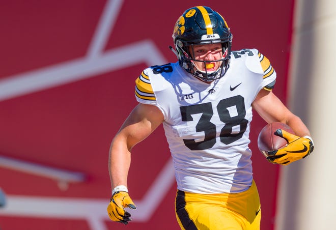 FILE - In this Oct. 13, 2018, file photo, Iowa tight end T.J. Hockenson (38) rushes the ball into the end zone to score during the second half of an NCAA college football game against Indiana, in Bloomington, Ind. Hockenson is a possible pick in the 2019 NFL Draft. (AP Photo/Doug McSchooler, File)