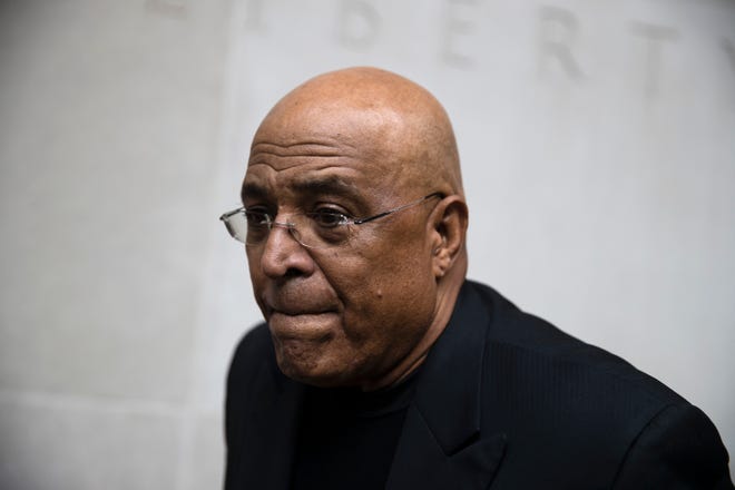 FILE - In this Aug. 1, 2017, file photo, former Reading Mayor Vaughn Spencer departs from the federal courthouse in Philadelphia. The former Pennsylvania mayor who rewarded individuals and businesses that donated to his campaign with expensive city contracts will be sentenced. (AP Photo/Matt Rourke, File)