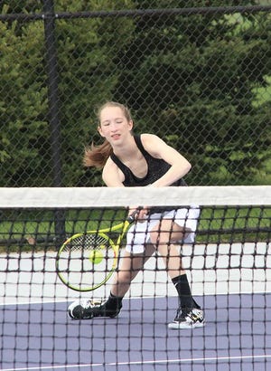 Sturgis’ Lilly Rehm hits a return shot in her match at three singles on Wednesday.