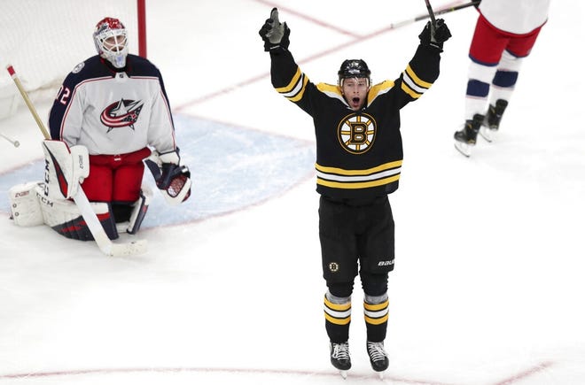 Boston Bruins center Charlie Coyle, right, celebrates after beating Columbus Blue Jackets goaltender Sergei Bobrovsky (72) for the game-winning goal during overtime of Game 1 of an NHL hockey second-round playoff series, Thursday, April 25, 2019, in Boston. The Bruins won 3-2. (AP Photo/Charles Krupa)