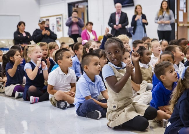 Odrielle' White shows takes part during a celebration to honor Johnson Elementary School students for being the top school from the ReadOKC summer reading program. [Chris Landsberger/The Oklahoman]