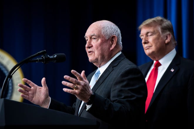 Secretary of Agriculture Sonny Perdue, left, and President Donald Trump at a signing ceremony for the farm bill -- H.R. 2, the "Agriculture Improvement Act of 2018" -- in the Eisenhower Executive Office Building on Dec. 20, 2018 in Washington, D.C. MUST CREDIT: Washington Post photo by Jabin Botsford