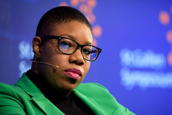 FILE - In this May 5, 2017 file photo, Symone Sanders, former National Press Secretary for Bernie Sanders, attends the St. Gallen Symposium, at the University of St. Gallen, Switzerland. Joe Biden has hired Symone Sanders, a prominent African American political strategist, as a senior adviser to his newly launched presidential campaign. The move adds a younger, diverse voice to Biden’s cadre of top advisers, which has been dominated by older white men. It suggests Biden is seeking to broaden his appeal to a new generation of Democrats. (Gian Ehrenzeller/Keystone via AP)