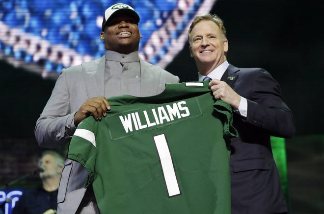 Alabama defensive tackle Quinnen Williams poses with NFL Commissioner Roger Goodell after the New York Jets selected Williams in the first round at the NFL football draft, Thursday, April 25, 2019, in Nashville, Tenn. (AP Photo/Mark Humphrey)