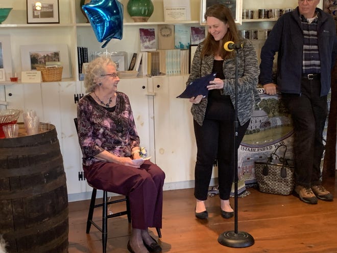 Lyn Maclean receives a proclamation declaring April 24, 2019 as Lyn Maclean Day from Town Manager Melissa Rodrigues. [MetroWest Daily News Staff Photo/Zane Razzaq]