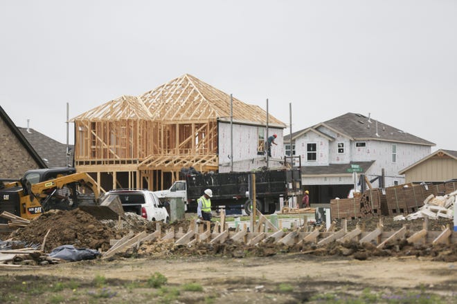 Construction crews work at the Sunfield in Buda development on April 17. Builders in the Austin metro area -- which spans from Georgetown to San Marcos -- started construction on 4,294 houses from January through March, a 6.9 percent increase from the first quarter of 2018, according to Metrostudy.

 [BRONTE WITTPENN/AMERICAN-STATESMAN]