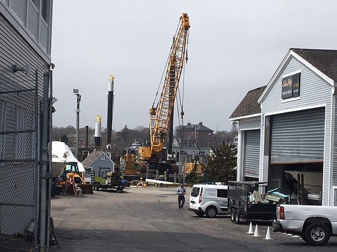 Lengthening the pier at Hyannis Harbor Marina. [PHOTO BY JOHN BASILE/WICKED LOCAL]