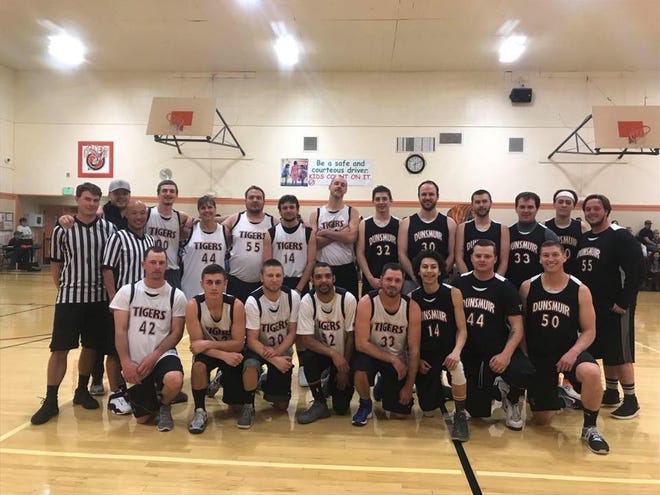 Participants from the 2018 Zach Swan Memorial Alumni game pose for a photo.