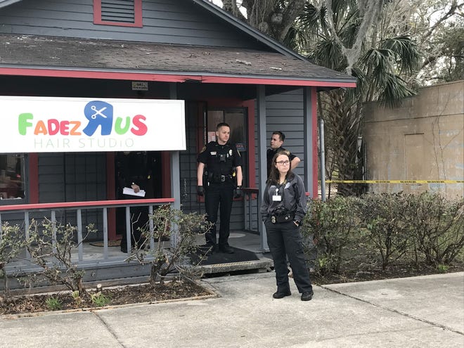 Ocala police officers are shown at the scene of a fatal shooting on Feb. 9. Calvin J. Williams, owner of Fadez R Us Hair Studio in Ocala, has been arrested on second-degree murder in connection with the homicide. [Austin L. Miller/Star-Banner/File]