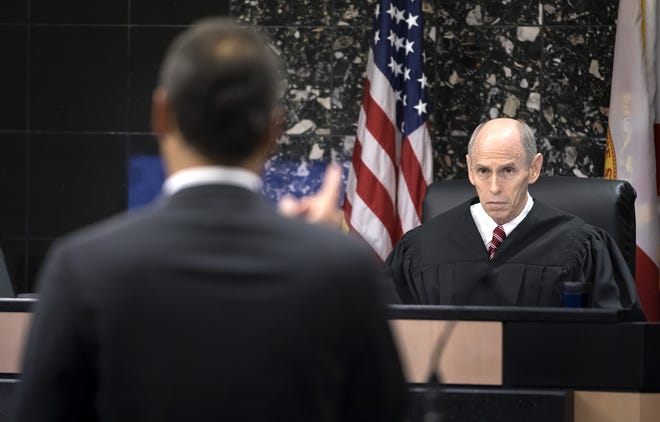Judge Leonard Hanser listens to Alex Spiro, attorney for Robert Kraft, during a motion hearing in West Palm Beach Friday morning, April 26, 2019. Attorneys argue that undercover surveillance videos allegedly showing their client paying for sex at a Jupiter day spa should be ruled inadmissible and the evidence thrown out. [LANNIS WATERS/palmbeachpost.com]