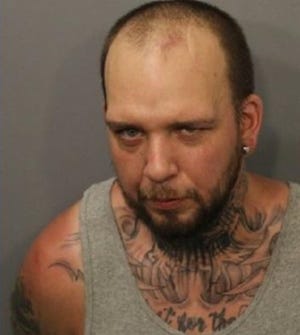 Brian Souza Jr. is one of two men accused of beating a disabled man and threatening to eat the man's dog. [FALLS RIVER POLICE DEPARTMENT]