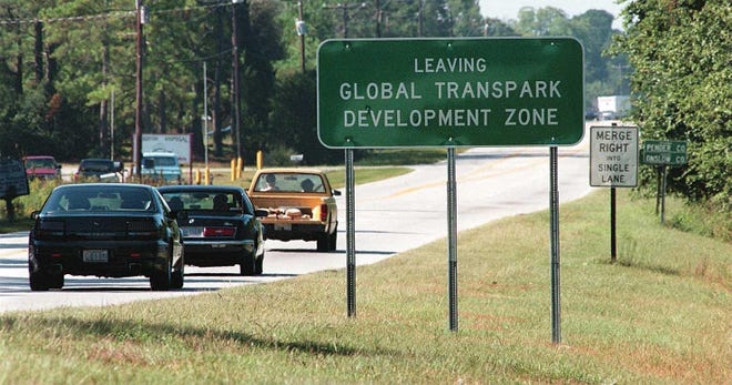 Drivers entering Pender County from Onslow are greeted by Global Transpark signs on US 17. Signs on are in both north and southbound lanes. [FILE PHOTO]